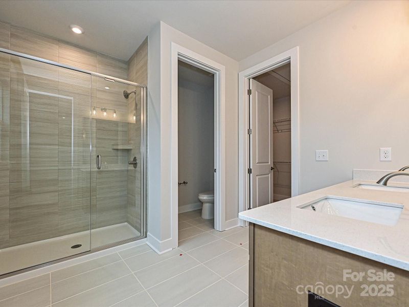 En suite spa-inspired primary bath.