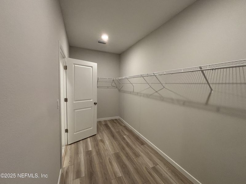 Spacious, unfurnished interior of a new home in The Cypress Series at Reserve East, Flagler Beach (Image 22).