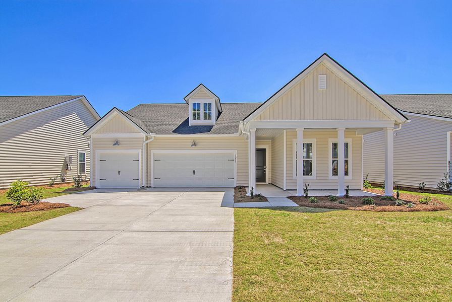 Front exterior of a new home in Horizons at Summers Corner | 55+: The Legends, Summerville, SC, highlighting curb appeal (Image 23).