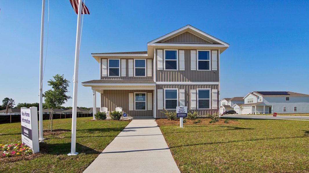 Representative exterior photo of a completed home built from the Inzer by D.R. Horton in Owl's Head East, Freeport, FL (Image 2). Representative exterior photo of a completed home built from the Inzer by D.R. Horton in Owl's Head East, Freeport, FL (Image 2).