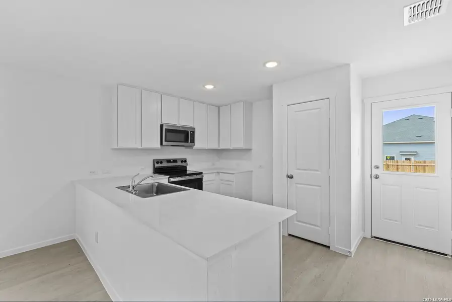 Furnished interior view inside a new home in Hidden Oasis, San Antonio (Image 10).