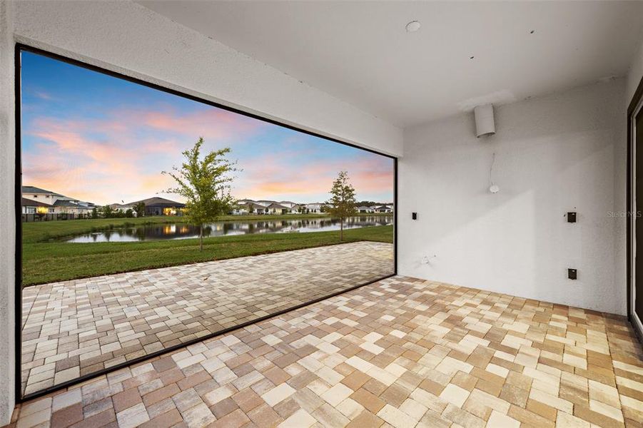 Exterior details and patio area of a home in Robin's Cove at Epperson, Wesley Chapel (Image 3).