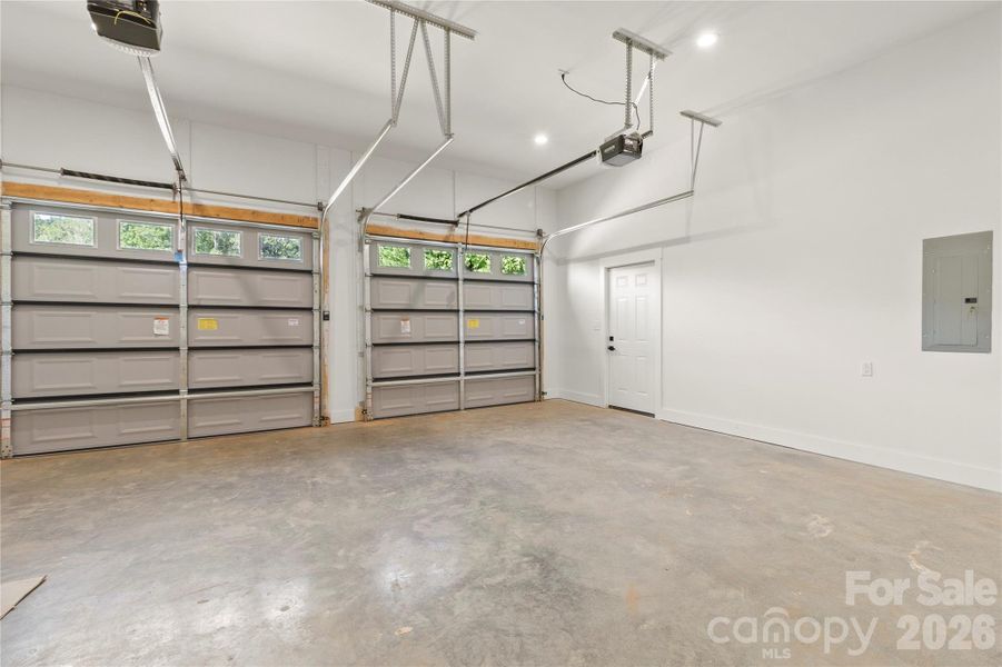 Large over size two car garage with extra tall ceilins. Side entrance door. Quiet openers feauturing MyQ technology.