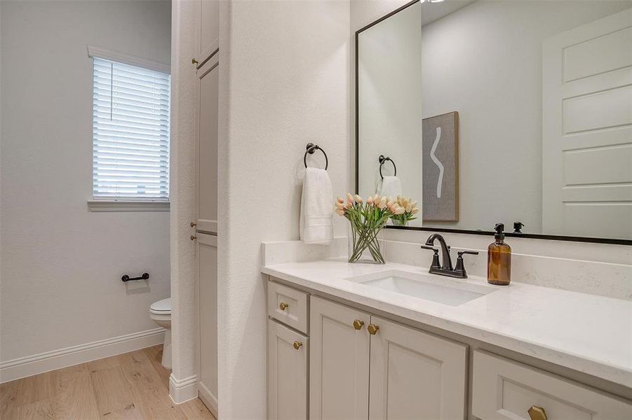 Powder bath with vanity and built ins for storage