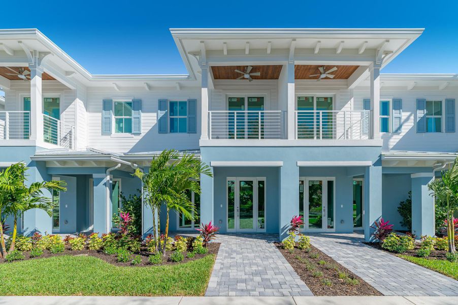 Front exterior of a new home in , Stuart, FL, highlighting curb appeal (Image 1).