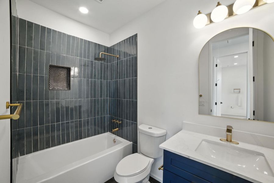 Full bathroom with vanity, shower combination, and recessed lighting Full bathroom with vanity, shower combination, and recessed lighting