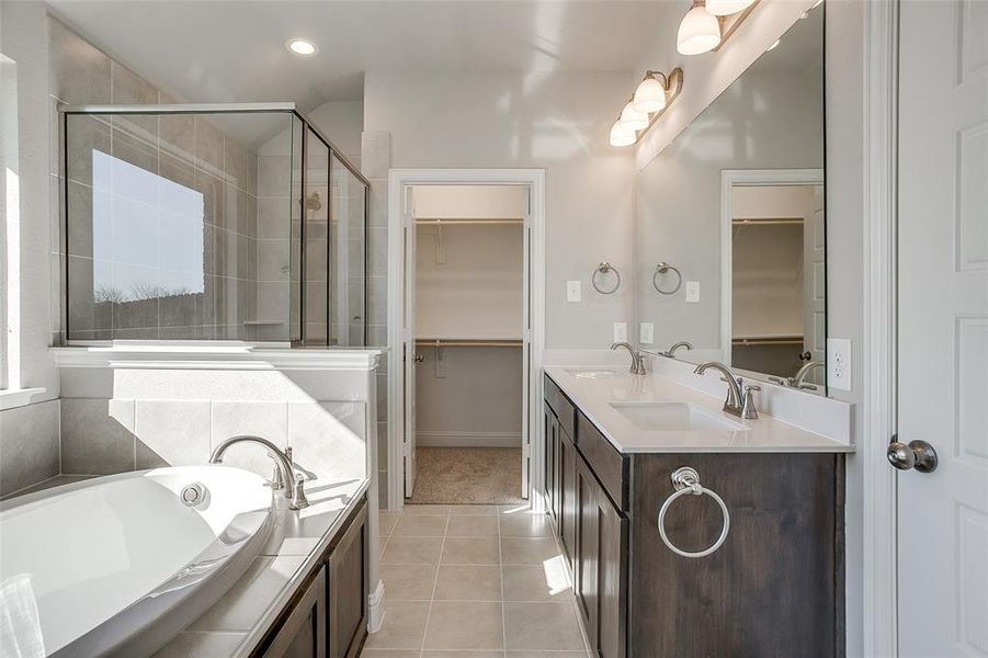 Bathroom with separate shower and tub, tile patterned floors, and vanity Bathroom with separate shower and tub, tile patterned floors, and vanity