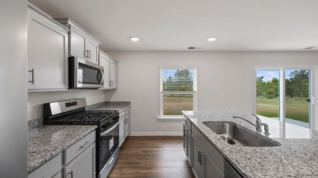 Furnished interior view inside a new home in Bentley Park, Greenwood (Image 6).