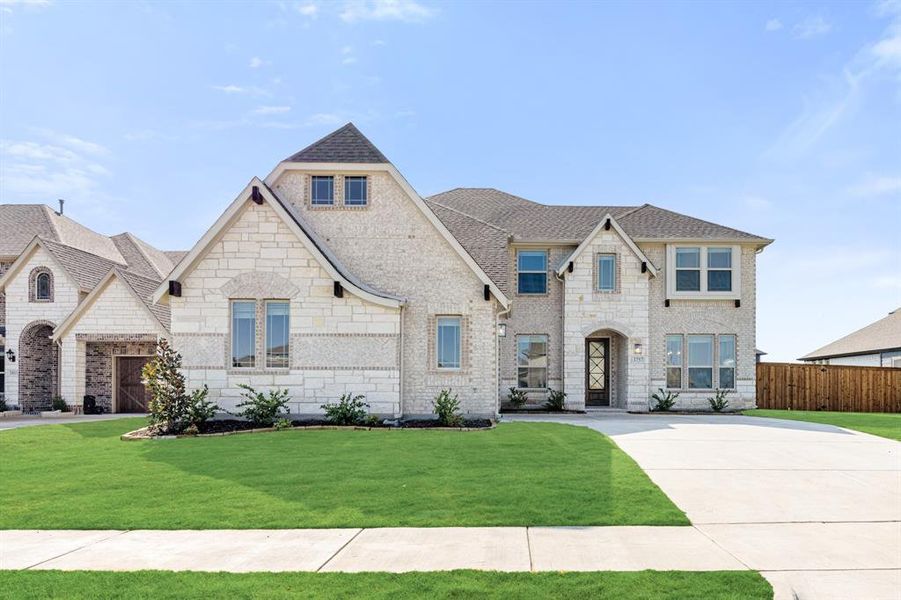 Front exterior of a new home in Terracina, Rockwall, TX, highlighting curb appeal (Image 1). Front exterior of a new home in Terracina, Rockwall, TX, highlighting curb appeal (Image 1).