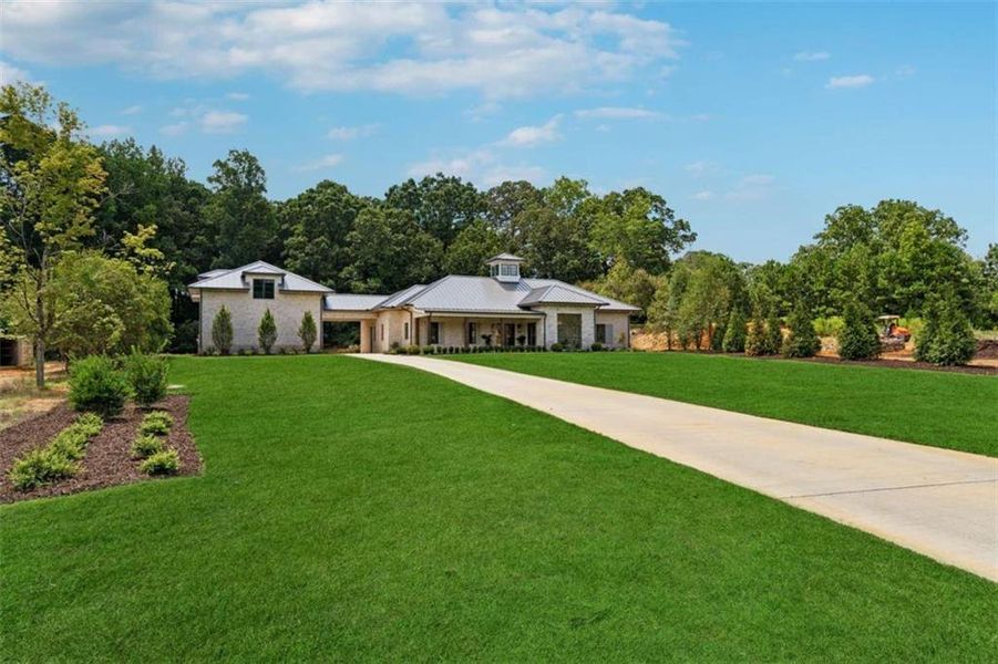 Front exterior of a new home in , Cumming, GA, highlighting curb appeal (Image 26). Front exterior of a new home in , Cumming, GA, highlighting curb appeal (Image 26).