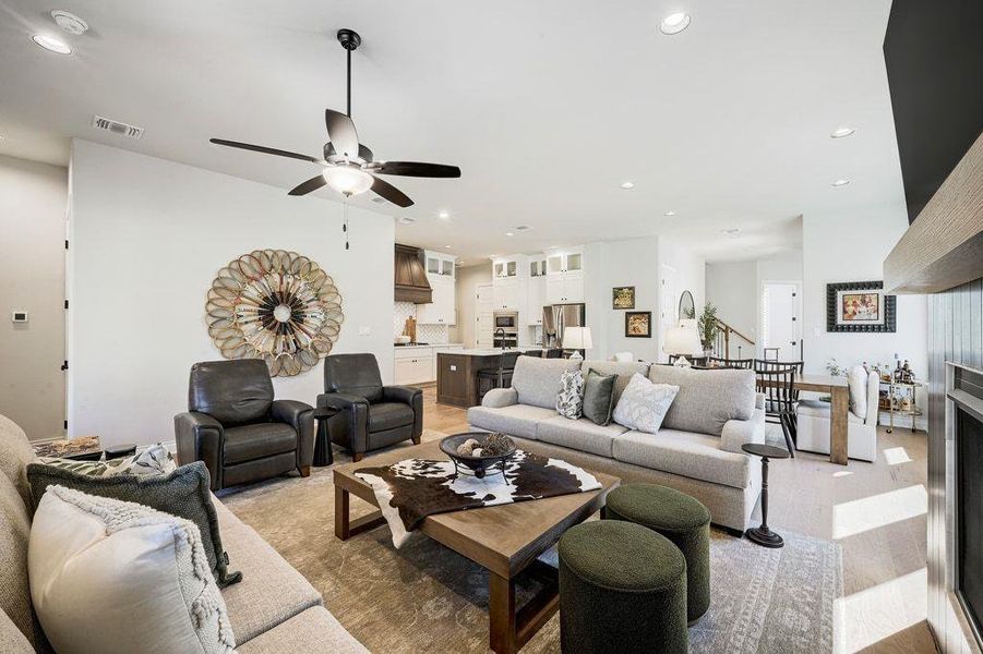 Living area with recessed lighting, light wood-style floors, and ceiling fan Living area with recessed lighting, light wood-style floors, and ceiling fan