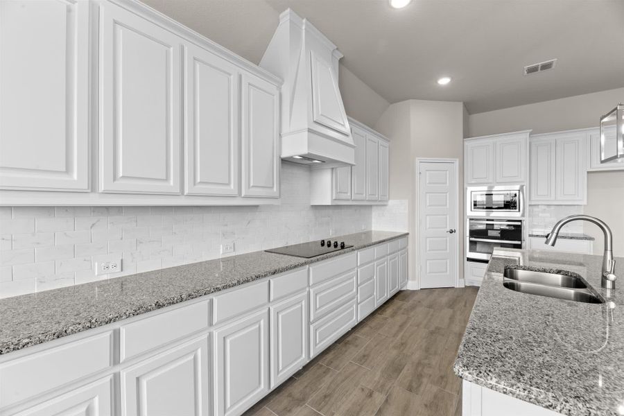 Kitchen | Concept 2796 at Coyote Crossing in Godley, TX by Landsea Homes