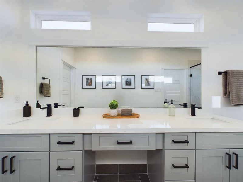 Beautiful primary bathroom with Quartz double sink vanity top and soft close drawers and doors. Photos from another development by Disama Group. FINISHES & COLORS MAY VARY