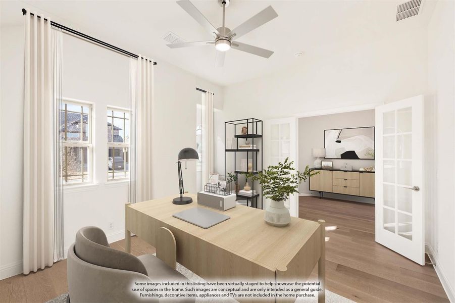 Home office with wood desk, ceiling fan, hardwood floors, and French doors opening to an adjacent room Home office with wood desk, ceiling fan, hardwood floors, and French doors opening to an adjacent room