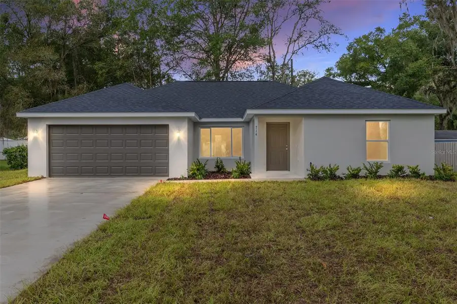 Front exterior of a new home in , Ocala, FL, highlighting curb appeal (Image 2).
