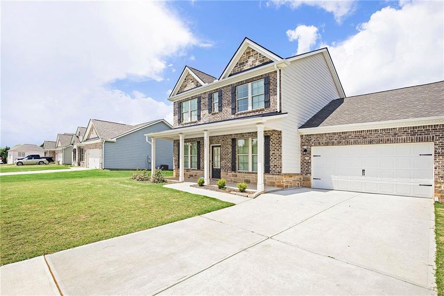 Front exterior of a new home in Vineyard Park, Griffin, GA, highlighting curb appeal (Image 16).
