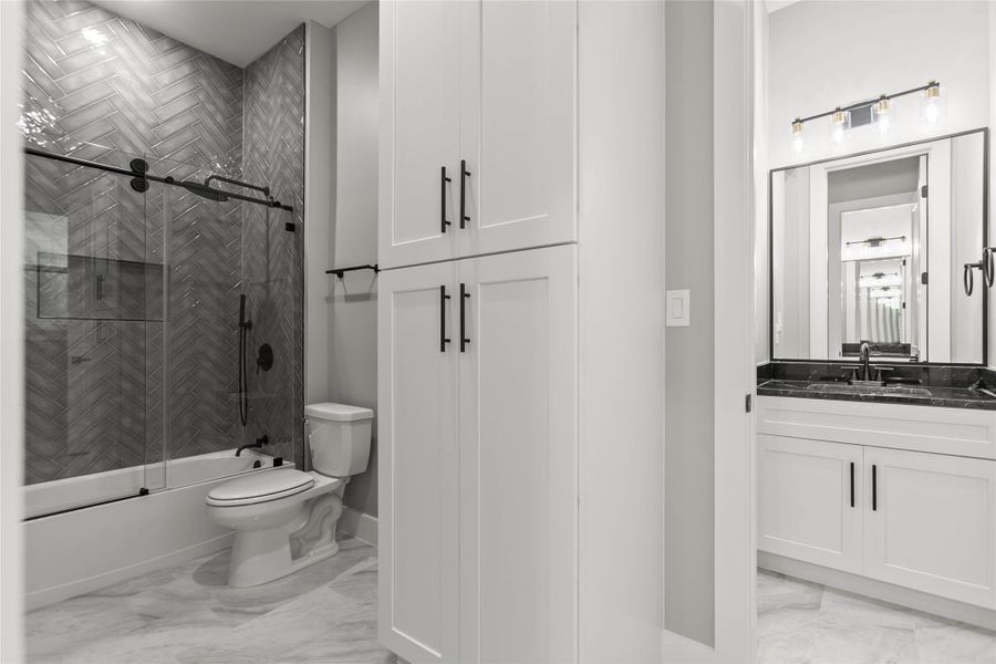 The glassed-in Jack and Jill tub/shower room shared by the secondary bedrooms The glassed-in Jack and Jill tub/shower room shared by the secondary bedrooms