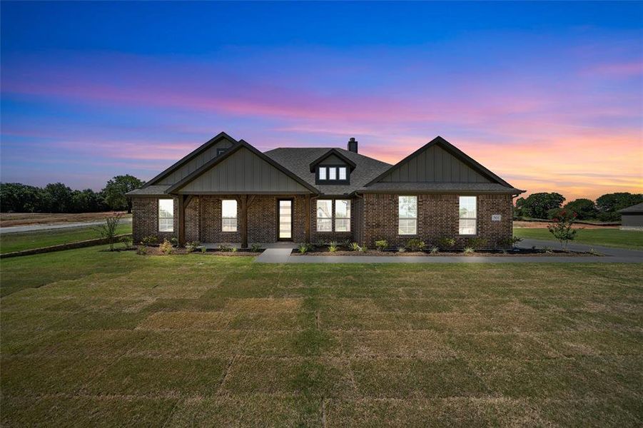 Front exterior of a new home in Oak Grove Addition, Springtown, TX, highlighting curb appeal (Image 20). Front exterior of a new home in Oak Grove Addition, Springtown, TX, highlighting curb appeal (Image 20).
