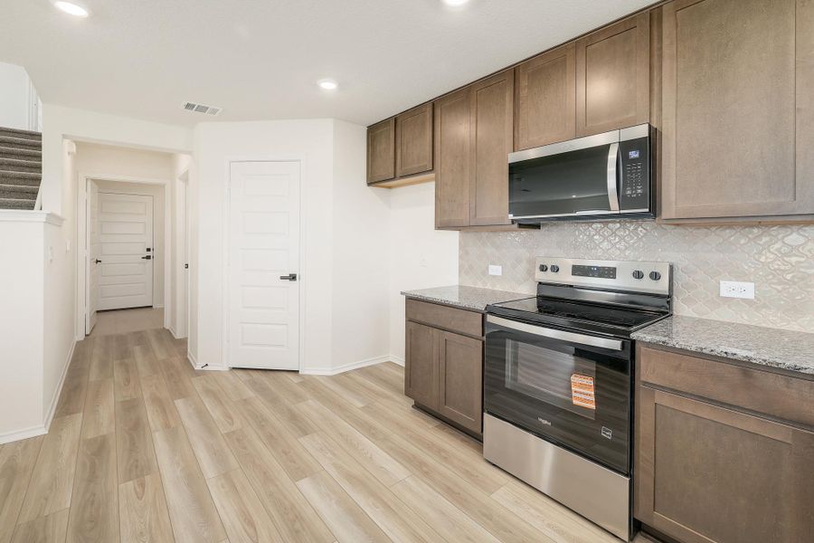 Furnished interior view inside a new home in Stoney Chase, Del Valle (Image 8).