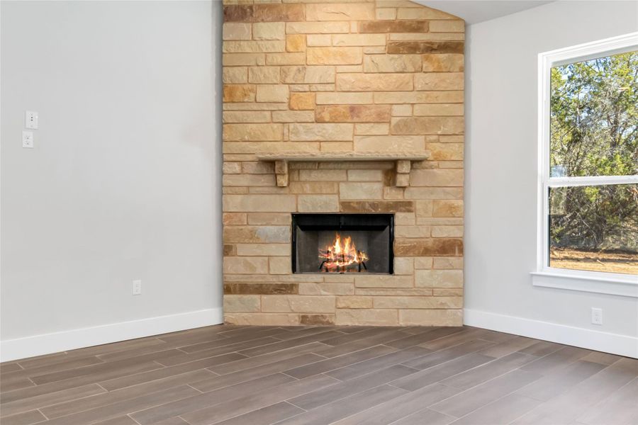 Interior space featuring hardwood / wood-style flooring and a fireplace