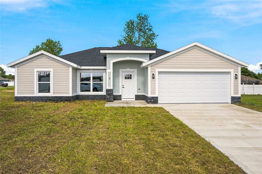 Front exterior of a new home in , Ocala, FL, highlighting curb appeal (Image 20).
