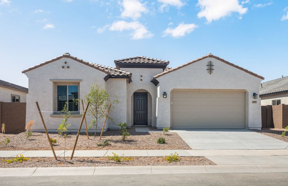 Front exterior of a new home in Artisan at Asante, Surprise, AZ, highlighting curb appeal (Image 22). Front exterior of a new home in Artisan at Asante, Surprise, AZ, highlighting curb appeal (Image 22).