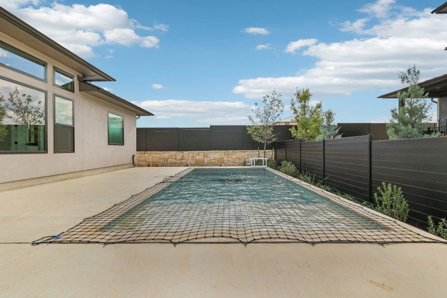 View of pool featuring a patio and a fenced backyard