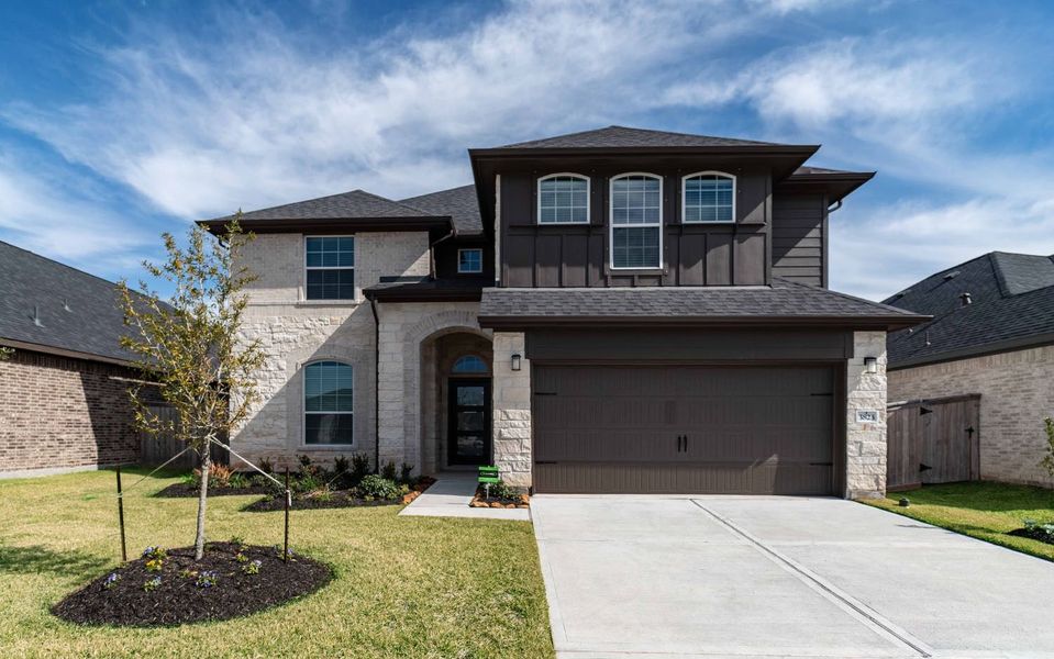 Front exterior of a new home in Mulberry Farms, Santa Fe, TX, highlighting curb appeal (Image 1). Front exterior of a new home in Mulberry Farms, Santa Fe, TX, highlighting curb appeal (Image 1).