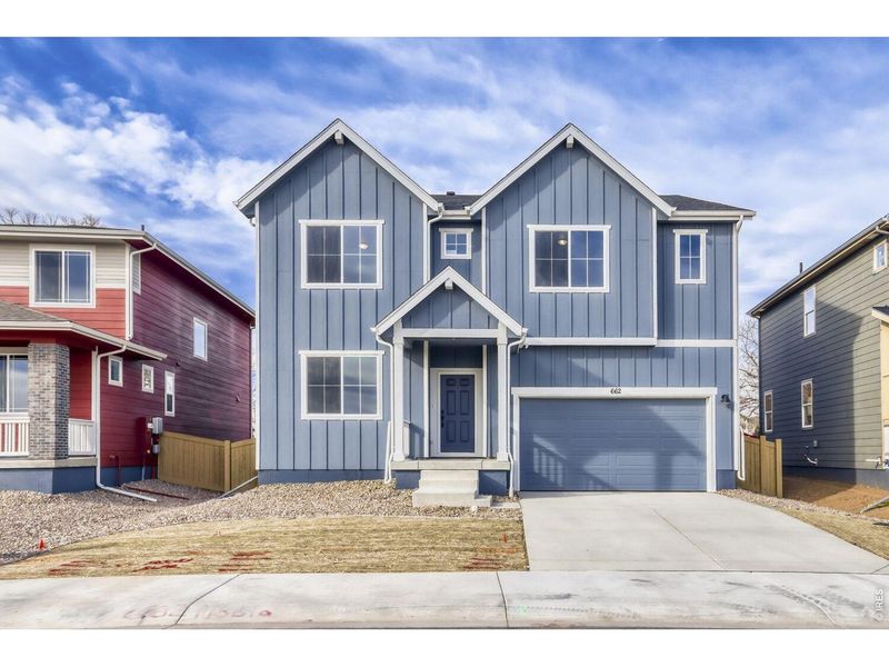 Front exterior of a new home in Trevenna, Windsor, CO, highlighting curb appeal (Image 20).