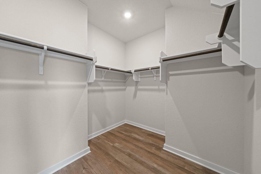 Walk-in closet in Primary Bedroom Walk-in closet in Primary Bedroom