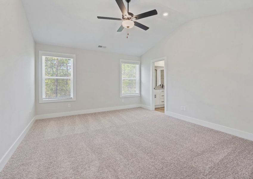 The master bedroom has cathedral ceilings