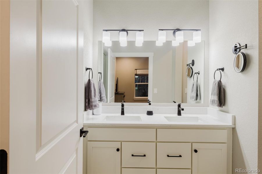 With dual vanities and plenty of storage, this primary bathroom is as functional as it is beautiful. There is a walk-in closet to the left. With dual vanities and plenty of storage, this primary bathroom is as functional as it is beautiful. There is a walk-in closet to the left.