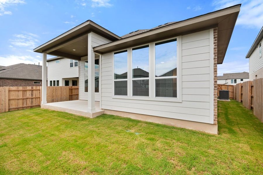 Front exterior of a new home in Arbor Collection at Lariat, Liberty Hill, TX, highlighting curb appeal (Image 29). Front exterior of a new home in Arbor Collection at Lariat, Liberty Hill, TX, highlighting curb appeal (Image 29).