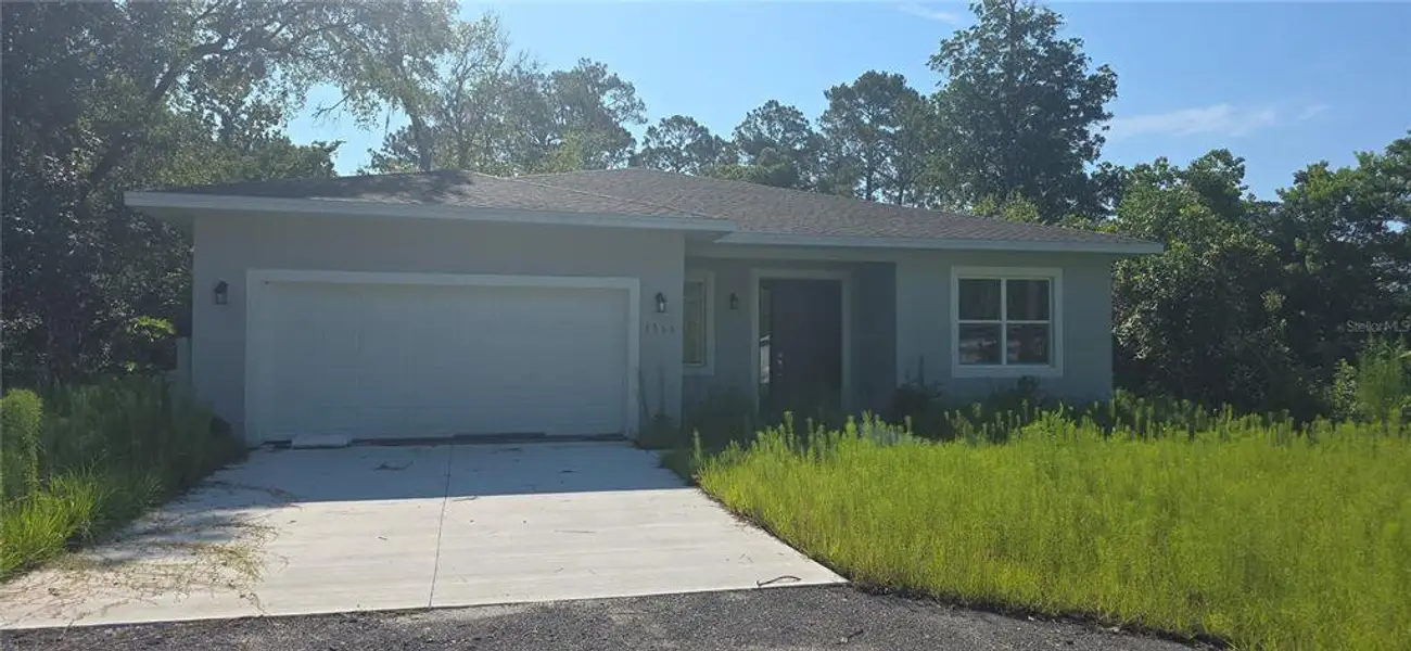 Front exterior of a new home in , Deland, FL, highlighting curb appeal (Image 1). Front exterior of a new home in , Deland, FL, highlighting curb appeal (Image 1).