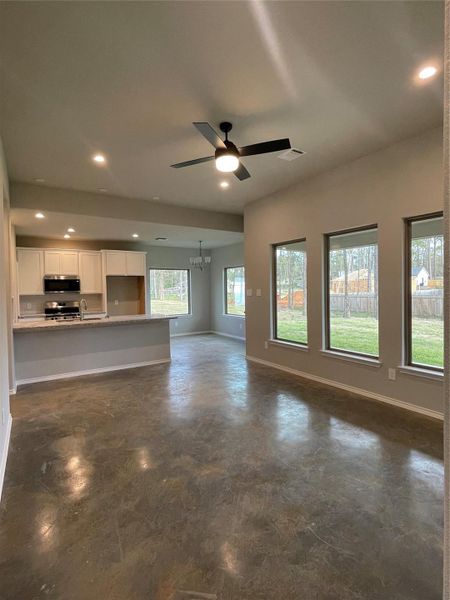 Spacious family room with Natural lighting from the Picture windows