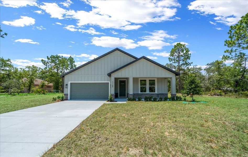 Front exterior of a new home in , Weeki Wachee, FL, highlighting curb appeal (Image 28). Front exterior of a new home in , Weeki Wachee, FL, highlighting curb appeal (Image 28).