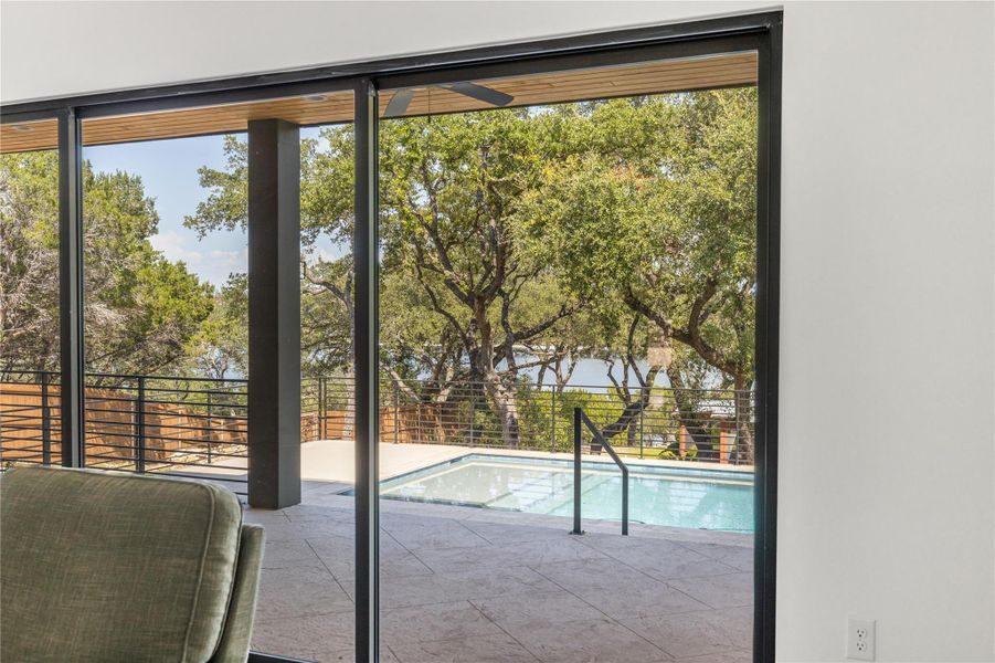 Doorway with view of wooded area