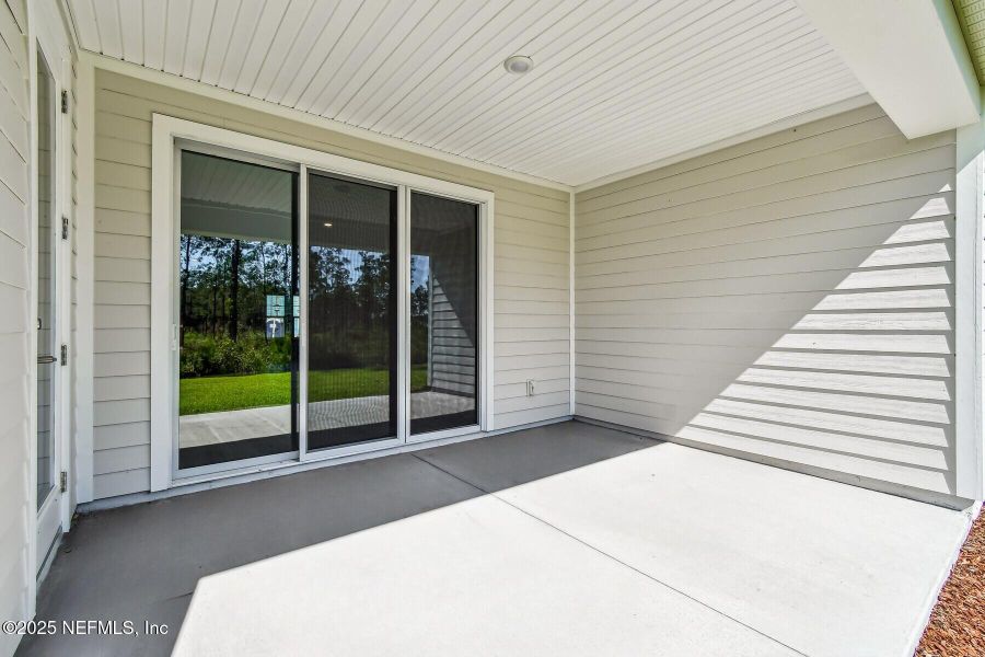 Exterior details and patio area of a home in Tributary 70', Yulee (Image 2).