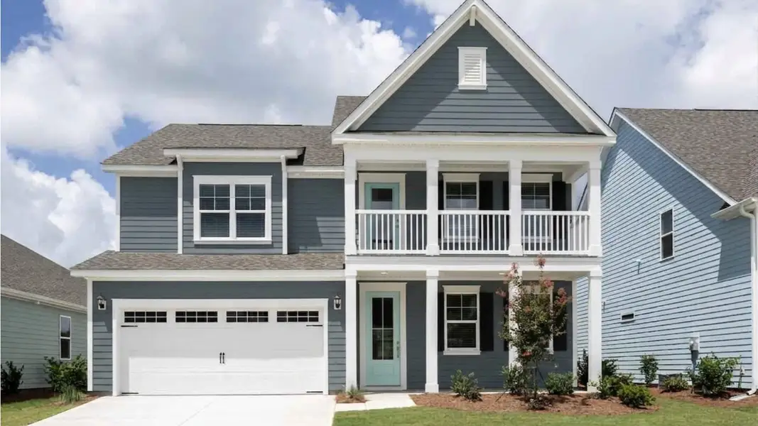 Front exterior of a new home in The Haven at Indigo Preserve, Leland, NC, highlighting curb appeal (Image 1). Front exterior of a new home in The Haven at Indigo Preserve, Leland, NC, highlighting curb appeal (Image 1).