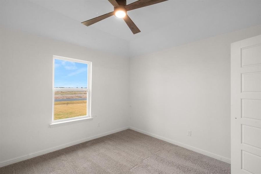 Spare room with ceiling fan and carpet Spare room with ceiling fan and carpet
