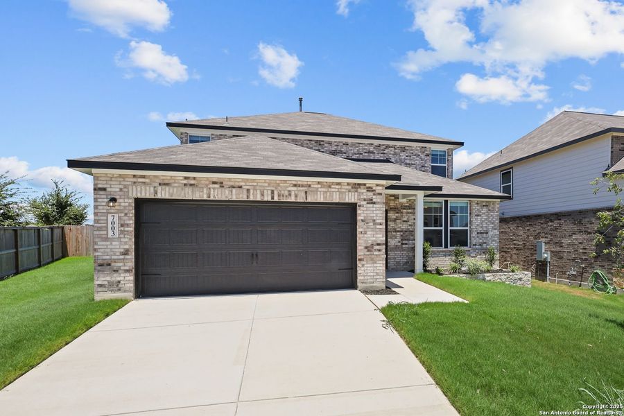 Front exterior of a new home in Comanche Ridge, San Antonio, TX, highlighting curb appeal (Image 42). Front exterior of a new home in Comanche Ridge, San Antonio, TX, highlighting curb appeal (Image 42).