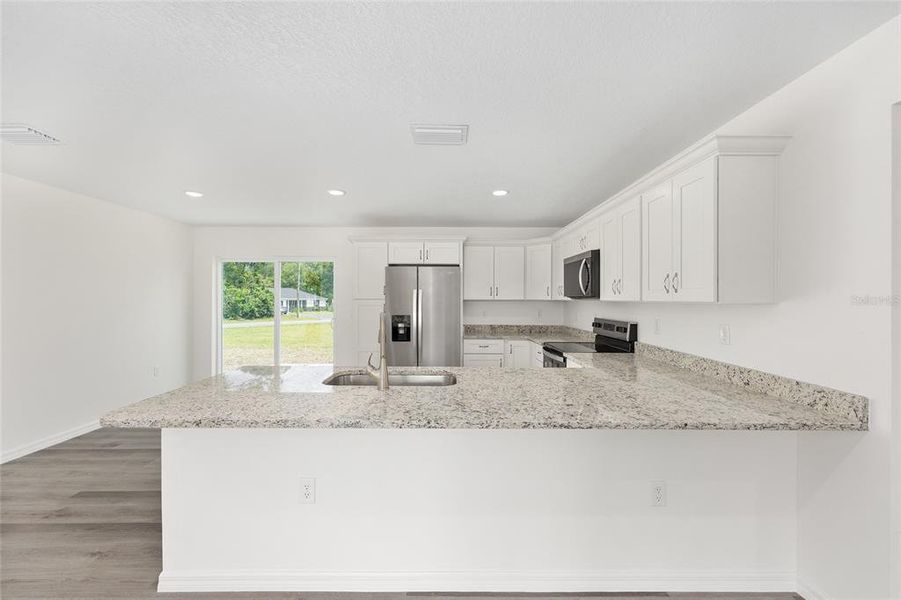 Furnished interior view inside a new home in , Dunnellon (Image 6).