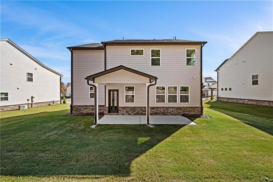 Exterior details and patio area of a home in The Paddocks at Doc Hughes, Buford (Image 2).