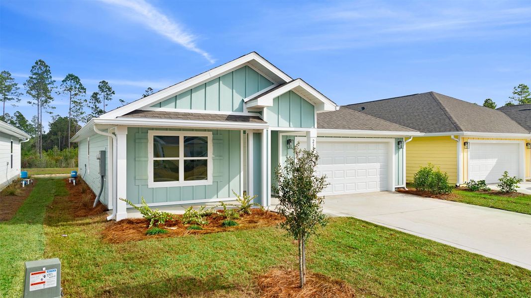 Front exterior of a new home in Ashton Park Phase III, Freeport, FL, highlighting curb appeal (Image 2).