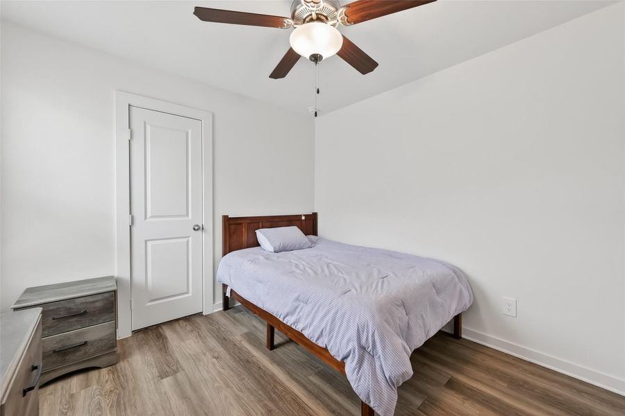 Secondary bedroom #3 featuring a walk-in closet for added storage