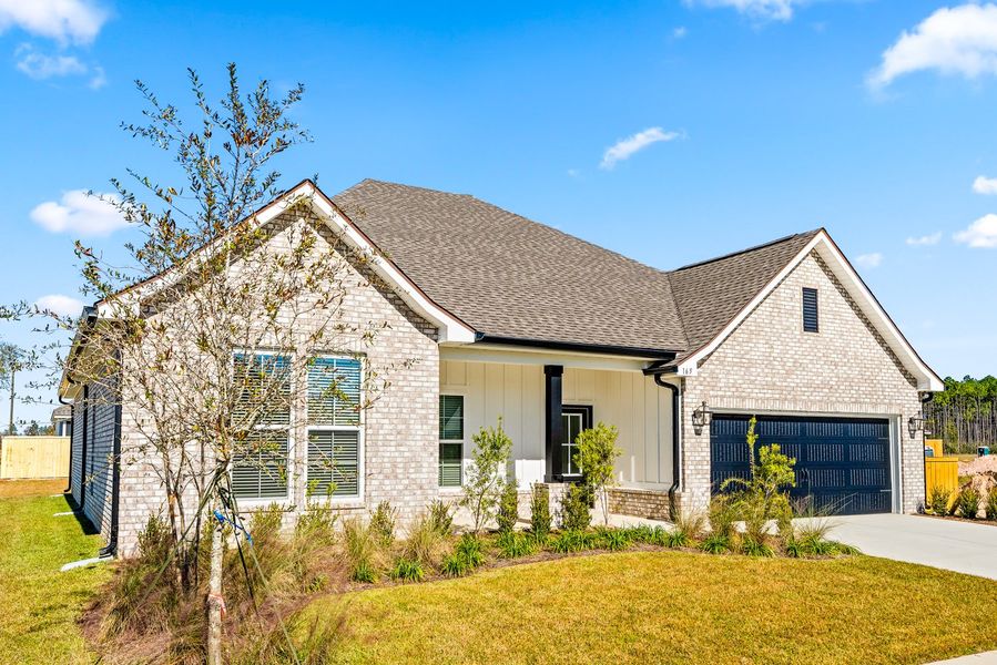 Front exterior of a new home in Natureview, Freeport, FL, highlighting curb appeal (Image 17).