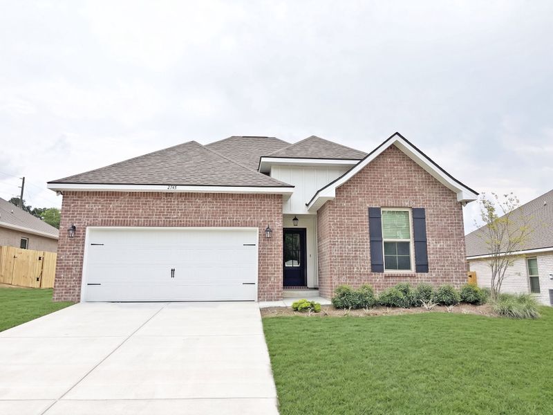 Front exterior of a new home in Young Oaks, Crestview, FL, highlighting curb appeal (Image 1). Front exterior of a new home in Young Oaks, Crestview, FL, highlighting curb appeal (Image 1).
