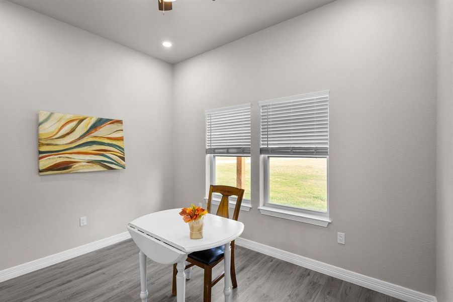 Dining area with wood finished floors, recessed lighting, and ceiling fan