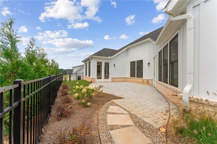 Exterior details and patio area of a home in The Courtyards of Franklin Goldmine, Cumming (Image 2).