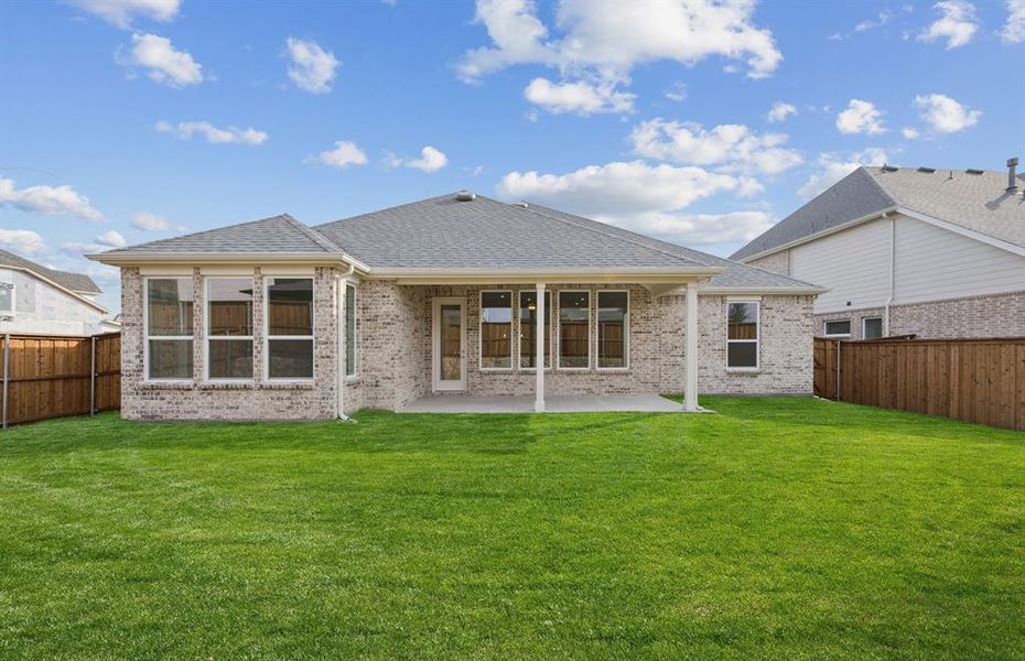 Large covered patio offers ample space for entertaining or relaxing Large covered patio offers ample space for entertaining or relaxing